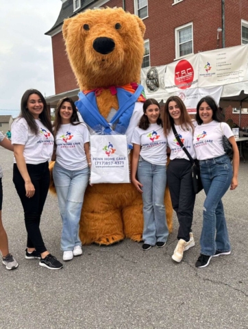 group photo with a mascot on its center